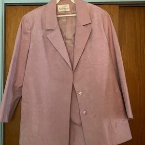 Used pink lining suit with skirt two front pockets and two button and split